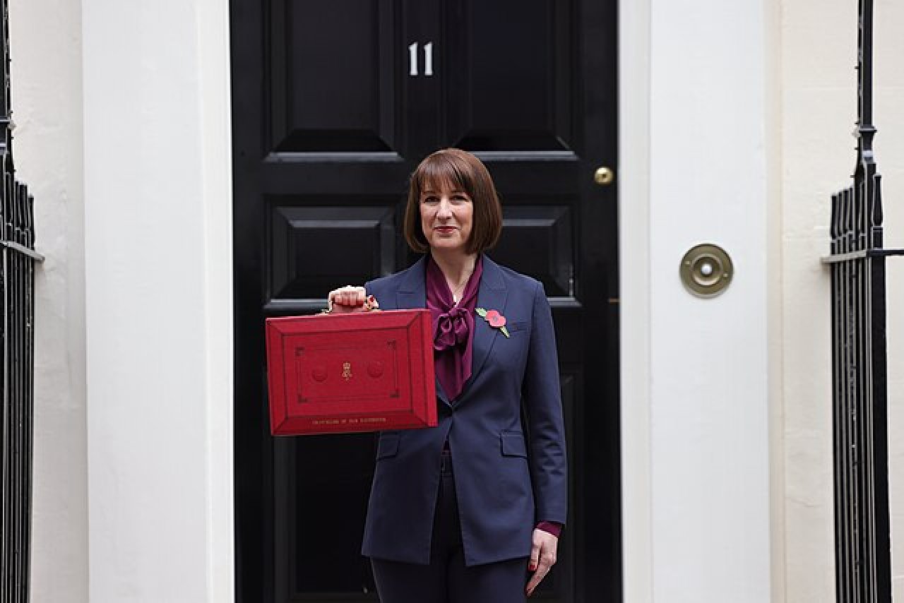 Labour Budget 2024: This image shows Rachel Reeves, Chancellor for the UK Labour government, holding up the famous red 'Budget Briefcase', in front of number 11 Downing Street.